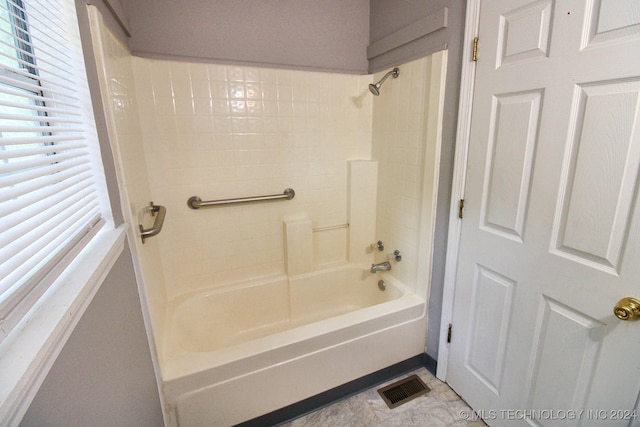 bathroom featuring tile patterned floors and shower / tub combination