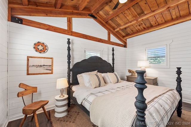 bedroom with vaulted ceiling with beams, wooden walls, dark hardwood / wood-style floors, and wood ceiling