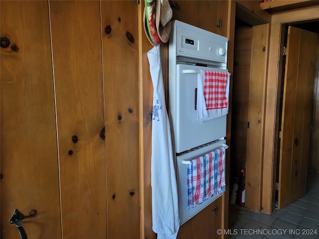 room details featuring wood walls and double oven