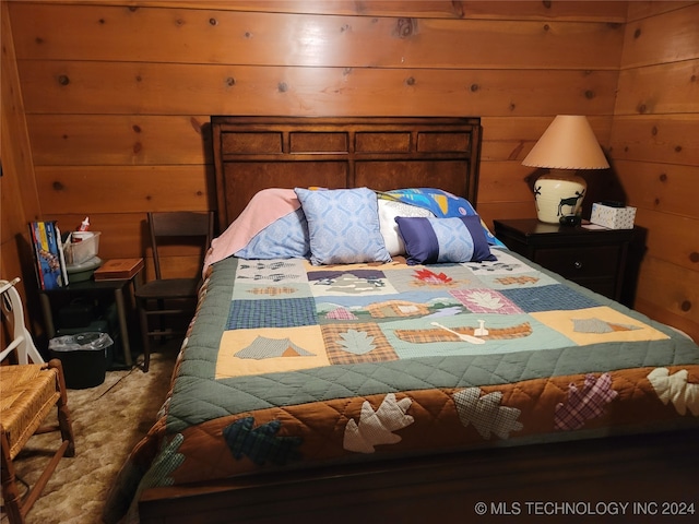 bedroom with wooden walls