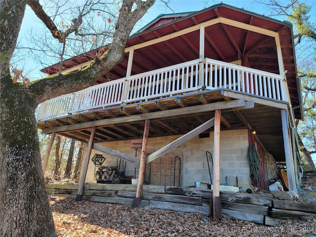 back of property with a wooden deck