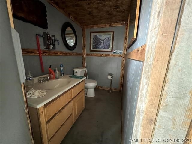 bathroom with vanity and toilet