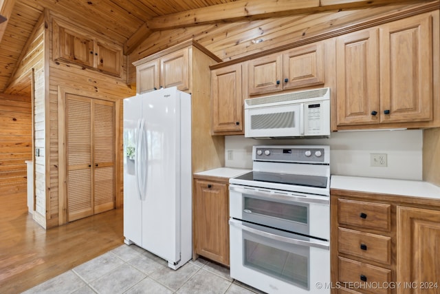 kitchen with lofted ceiling with beams, wooden walls, wood ceiling, white appliances, and light tile patterned floors