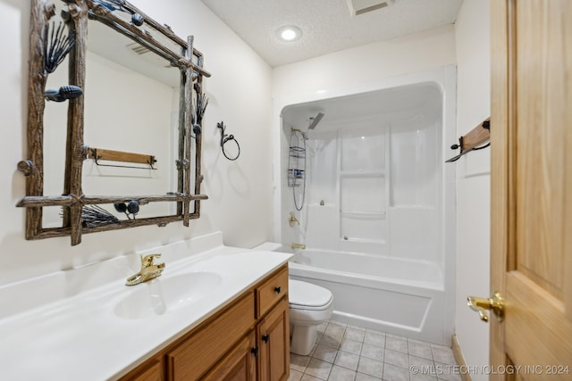 full bathroom featuring vanity, tile patterned flooring, shower / bath combination, toilet, and a textured ceiling