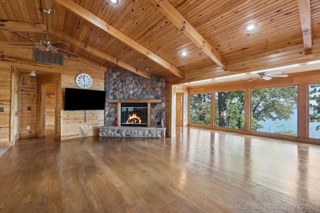 unfurnished living room featuring wood-type flooring, wood ceiling, and wood walls