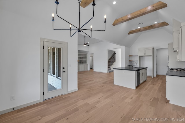 kitchen featuring white cabinets, ceiling fan with notable chandelier, light wood-type flooring, beam ceiling, and decorative light fixtures