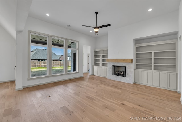 unfurnished living room featuring light hardwood / wood-style floors and ceiling fan