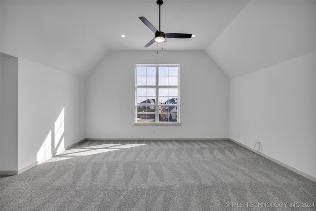 bonus room with lofted ceiling, ceiling fan, and carpet floors