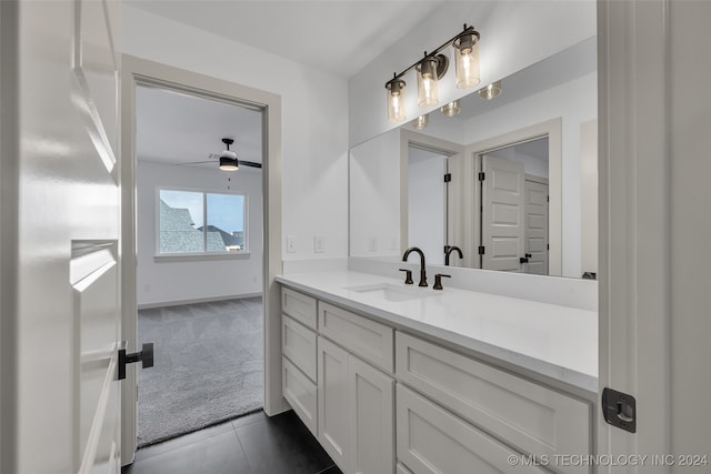 bathroom with ceiling fan, vanity, and tile patterned floors