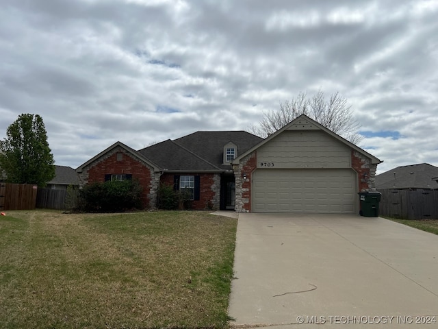 single story home with a garage and a front yard