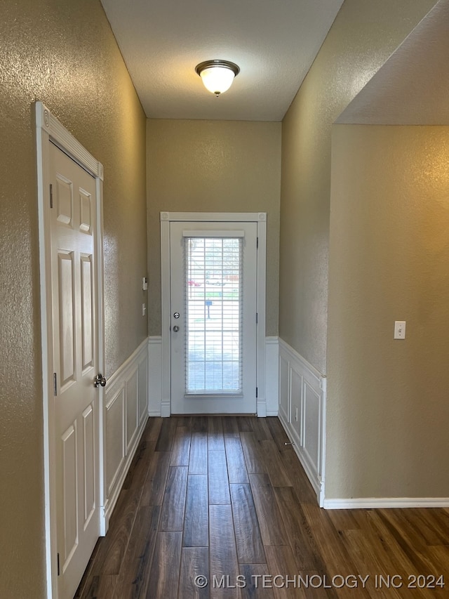 doorway to outside with dark hardwood / wood-style flooring