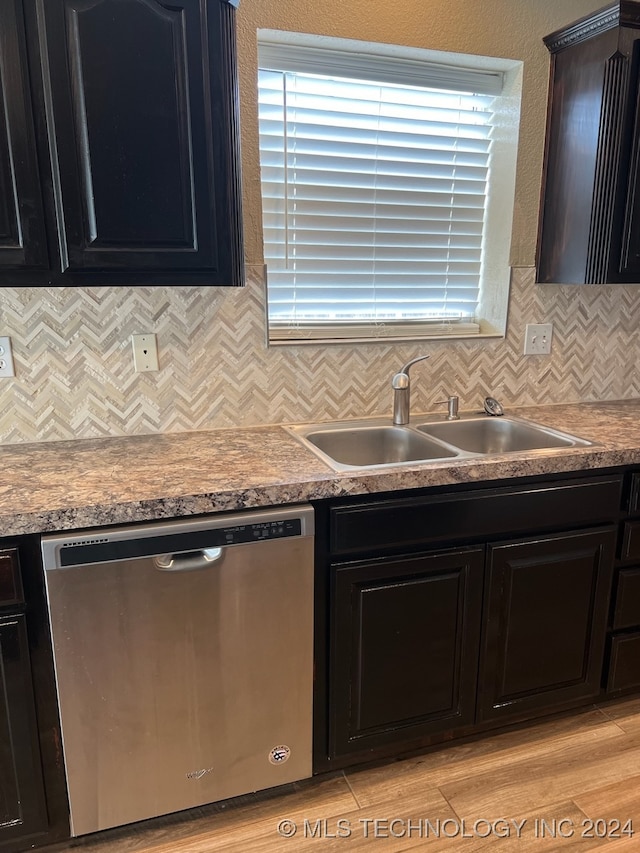 kitchen with decorative backsplash, dishwasher, light hardwood / wood-style flooring, and sink