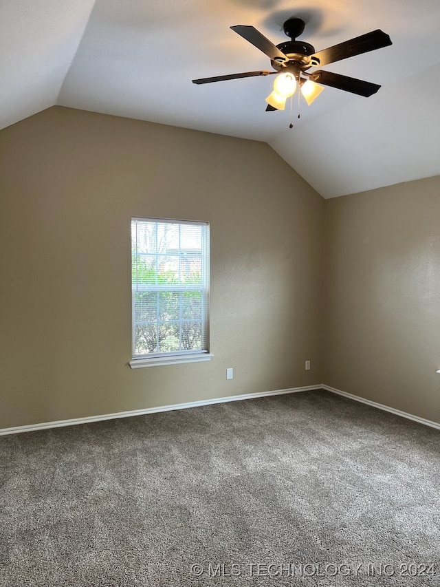 unfurnished room with ceiling fan, vaulted ceiling, and carpet