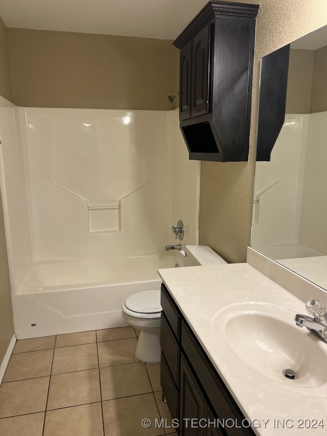 full bathroom with bathing tub / shower combination, tile patterned flooring, vanity, and toilet