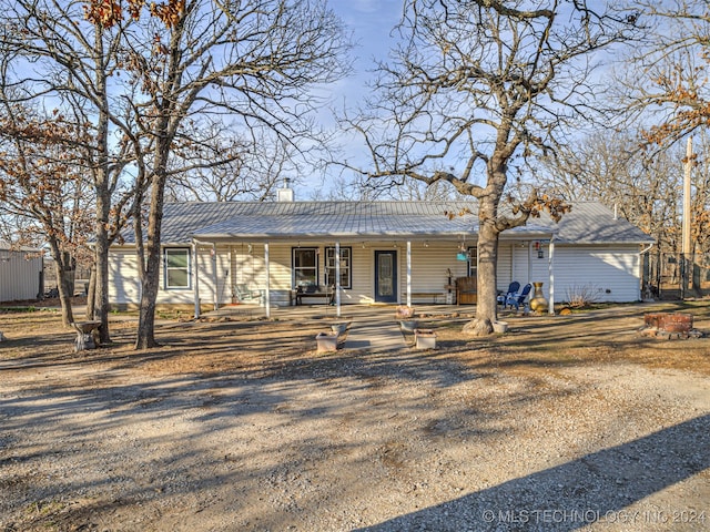 ranch-style house featuring covered porch