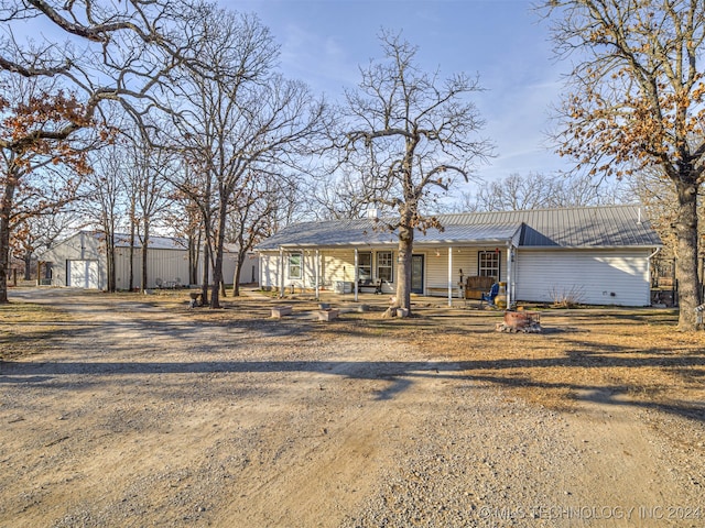 view of front facade with covered porch and a garage