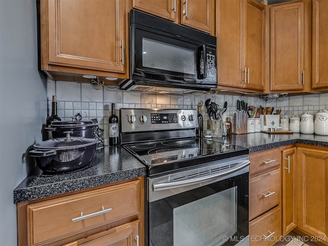 kitchen featuring stainless steel range with electric stovetop and tasteful backsplash