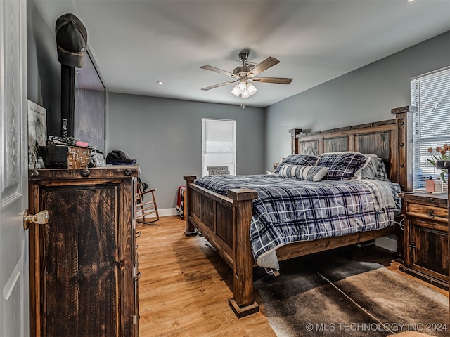 bedroom featuring ceiling fan and light wood-type flooring