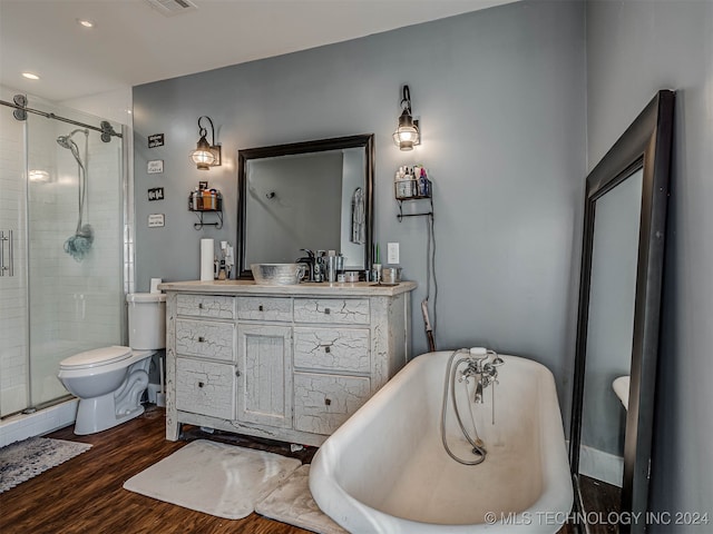 full bathroom with shower with separate bathtub, vanity, toilet, and hardwood / wood-style floors