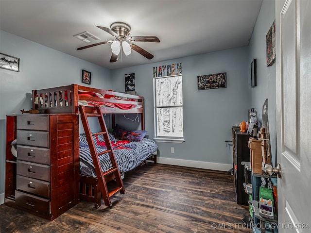 bedroom featuring ceiling fan and dark hardwood / wood-style floors