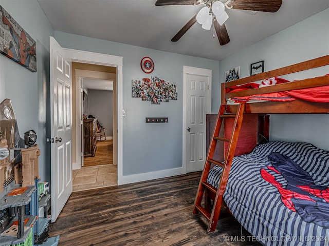 bedroom with hardwood / wood-style floors and ceiling fan