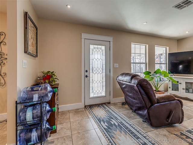 foyer with light tile patterned floors