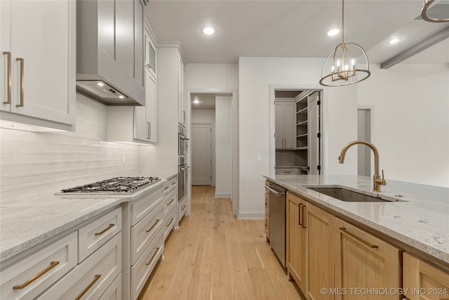 kitchen with white cabinetry, light brown cabinetry, and custom range hood