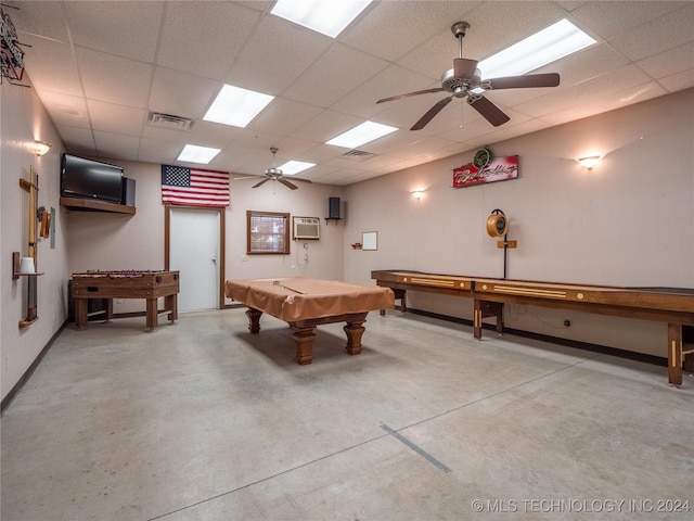 game room featuring ceiling fan, concrete flooring, a drop ceiling, pool table, and a wall unit AC