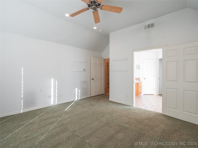 empty room featuring ceiling fan, carpet, and high vaulted ceiling