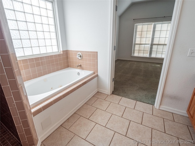 bathroom featuring tiled tub