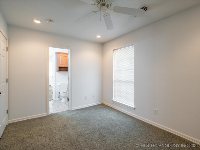 empty room featuring ceiling fan and carpet flooring