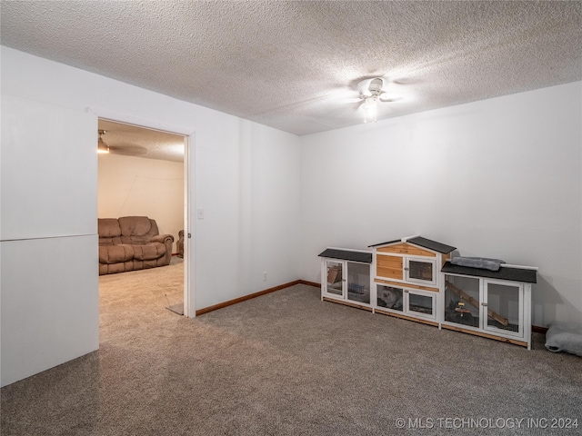 empty room featuring a textured ceiling and ceiling fan