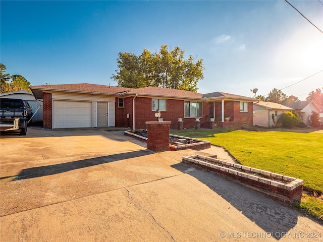 single story home featuring a front yard and a garage