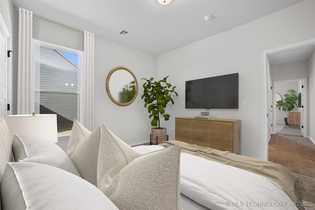 bedroom with wood-type flooring