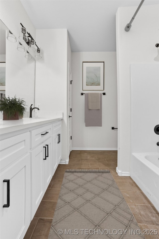 bathroom with vanity and shower / bathing tub combination