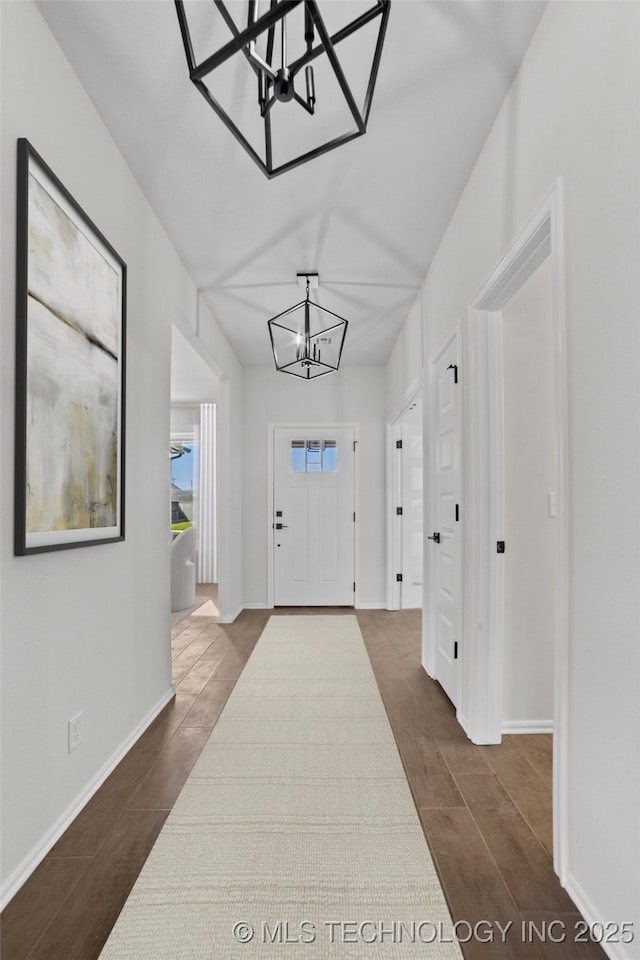 entryway with an inviting chandelier