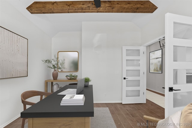 home office featuring dark hardwood / wood-style flooring and lofted ceiling with beams