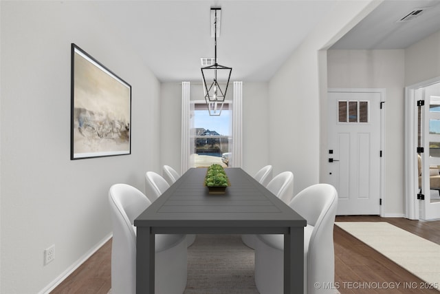 dining area with dark wood-type flooring