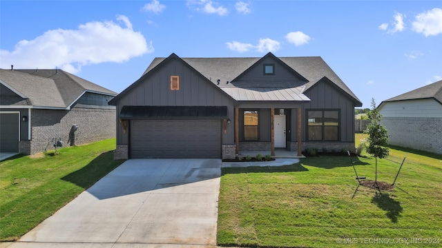 view of front of property with a front lawn and a garage