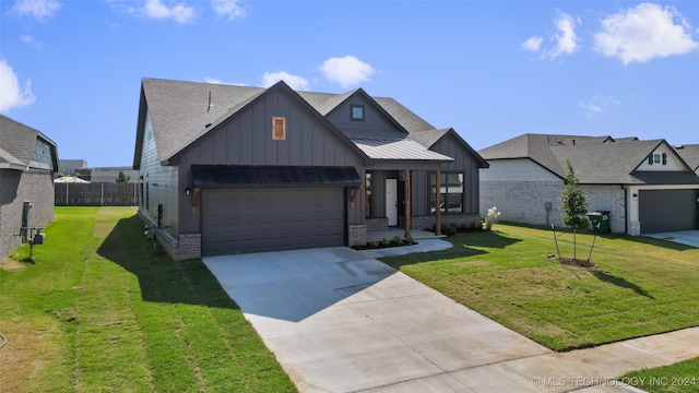 view of front of home featuring a garage and a front lawn