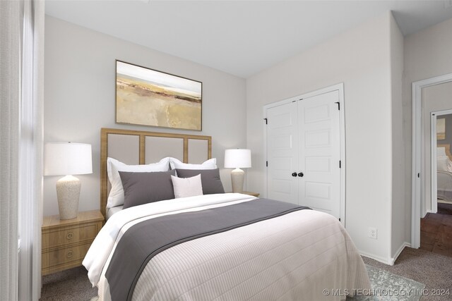 carpeted bedroom with a closet