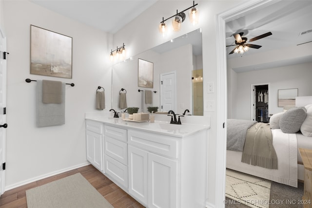 bathroom featuring vanity, wood-type flooring, and ceiling fan