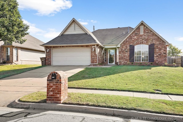 view of front of house featuring a garage and a front yard