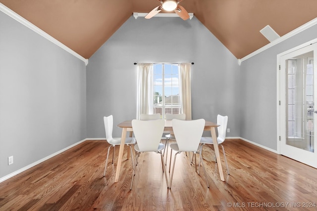 unfurnished dining area featuring crown molding, high vaulted ceiling, ceiling fan, and hardwood / wood-style flooring