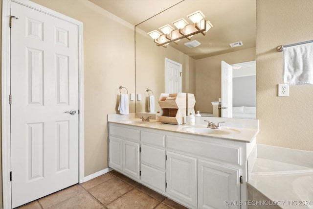 bathroom with tile patterned flooring and vanity