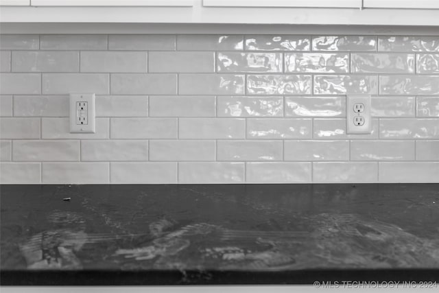 room details featuring dark stone countertops