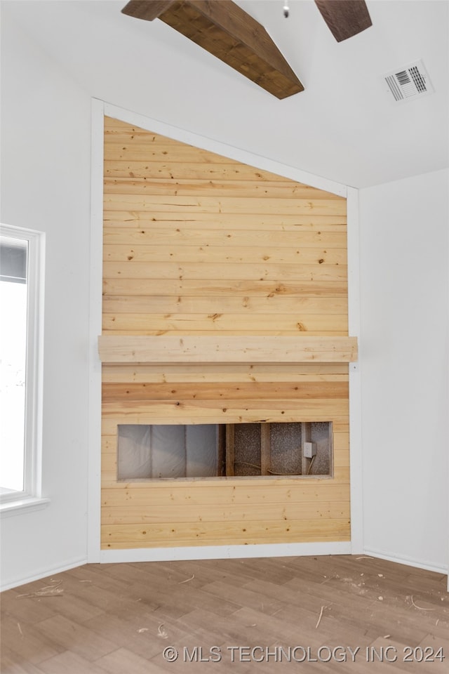 view of sauna / steam room featuring wood walls and wood-type flooring