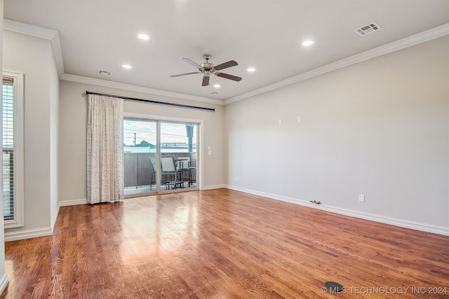 1331 E 41st Pl, Tulsa, OK 74105 - unfurnished room with wood finished floors, visible vents, a ceiling fan, and baseboards