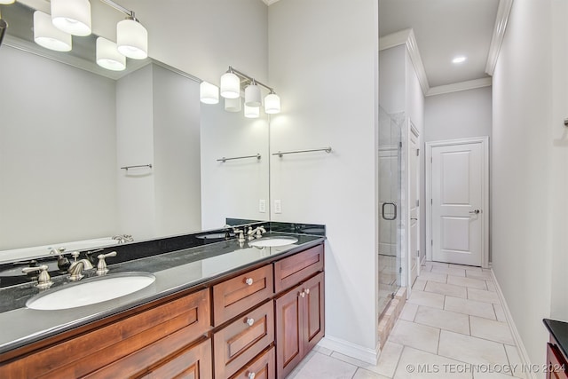 bathroom with walk in shower, ornamental molding, vanity, and tile patterned floors