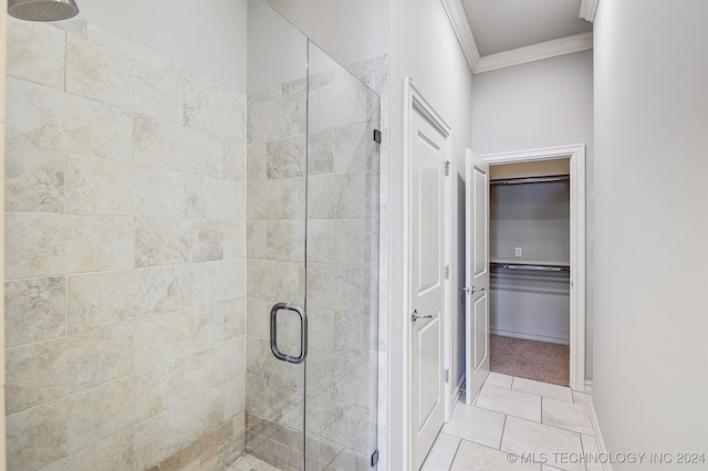 bathroom featuring walk in shower, tile patterned floors, and crown molding